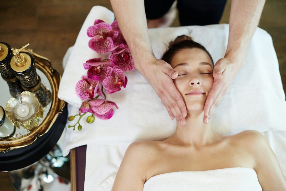woman-enjoying-face-massage-in-spa-e1613528997522.jpg